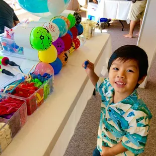 My son picking out his balloon.