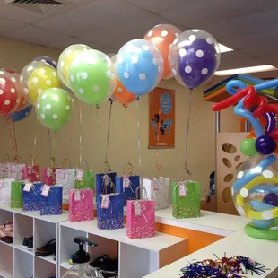 Gumball inside balloon with polka dots and whimsical swirls on top balloons at Gymboree Play Gym
