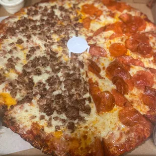 Half pepperoni and half sausage pizza