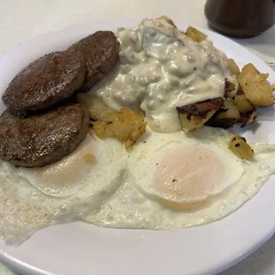 Over easy with sausage and potatoes. Sausage gravy on the potatoes.