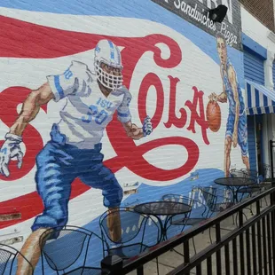 Celebrating ISU sports mural on the side of the Tavern by Michael Neary