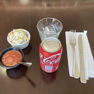 Simple table setting; with red salsa and cortido