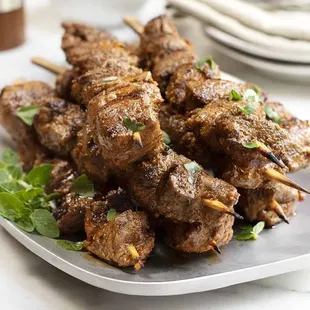 meat skewers on a plate