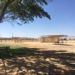 Covered area with a table &amp; grills to cook.