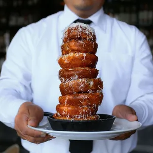 The stacks are high with our crispy onion rings sprinkled with parmesan!