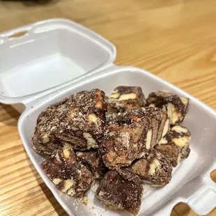 a container of chocolate and nuts