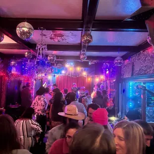 a crowd of people at a party