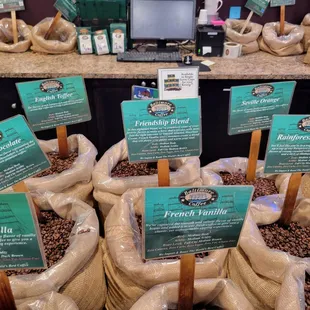 Some of the coffee beans that are available for pour over or for purchase by the pound.