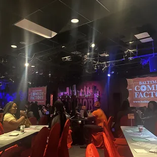 a crowd of people sitting at tables