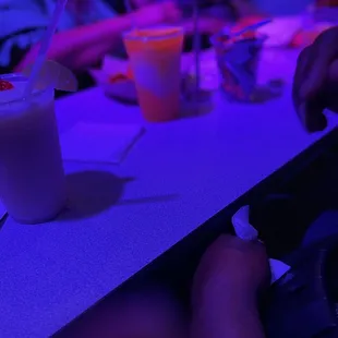 a person sitting at a table with a glass of milk