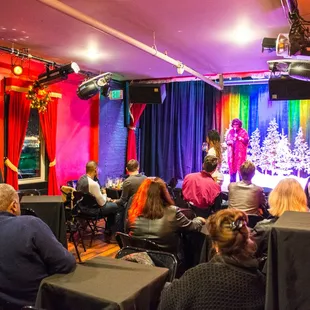 a crowd of people in a brightly lit room
