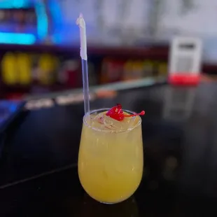 a drink in a glass with a straw
