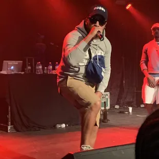 a man on stage with a microphone