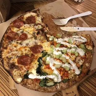 a half eaten pizza on a cutting board