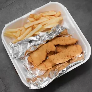 Juicy chicken tender with fries.