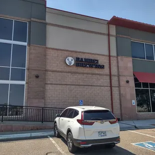 a car parked in front of a building