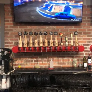 beer taps on a brick wall
