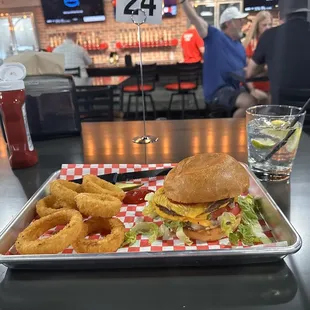 Classic Burger with onion rings and a Yitos and club soda