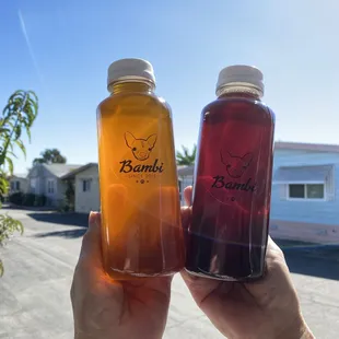 Assam tea bottle and jasmine tea bottle.