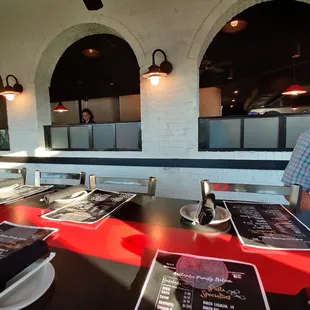 a man sitting at a table in a restaurant