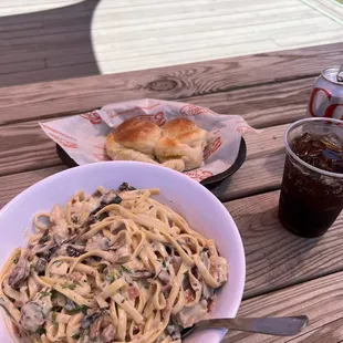 Pasta Carbonara with chicken and garlic bread.