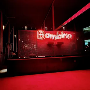 Large covered patio behind the sign