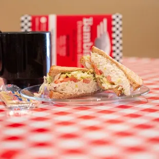 a sandwich and a cup of coffee
