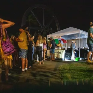 a crowd of people at a fair