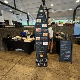 a surfboard with a menu on it