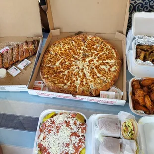 Pizza, salad, sandwiches, wings, Philly roll calzone