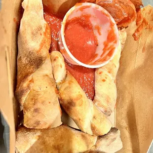 Breadsticks lacked flavor. Delivered in a box too small to fit the marinara so it spilled by delivery.