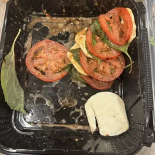 This was how the Caprese salad arrived. Pretty sure this was due to careless handling.