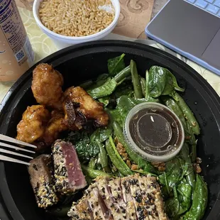 The chef Chef's Special Seared Ahi Tuna, and some Orange Peel chicken on the left side (given to me by my mom). Fried rice up top