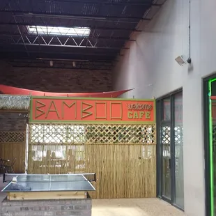 Sign. It's in the corner of the shopping center, in the back.