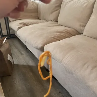 a hand holding a piece of food