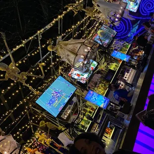 people playing video games at night