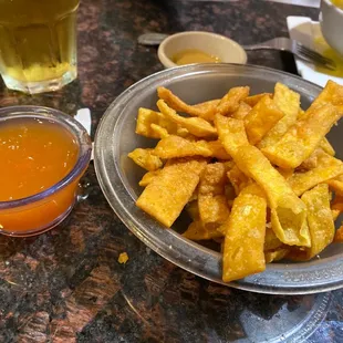 Free appetizer they bringing a fried wontons and sweet-and-sour sauce