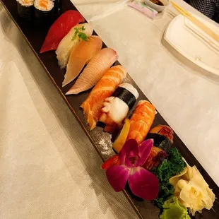 a long rectangular platter of sushi