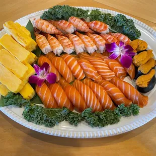 Tamago sashimi, salmon nigiri, uni, shrimp nigiri