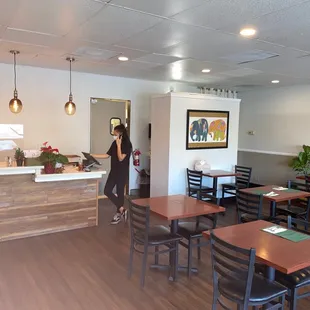 a woman standing at the counter