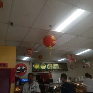 a man standing in a chinese restaurant