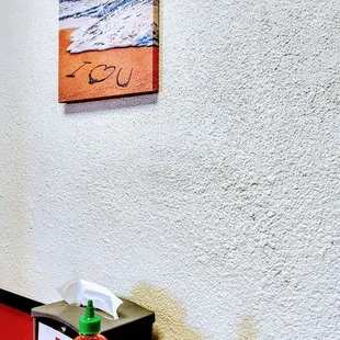 a picture of a red fire hydrant on a wooden table