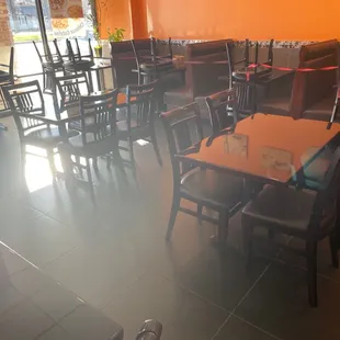 empty tables and chairs in a restaurant