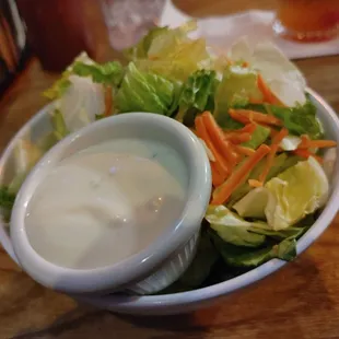 a bowl of salad with dressing
