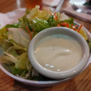a bowl of salad with dressing