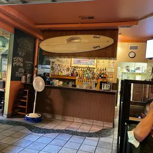 a surfboard in the background