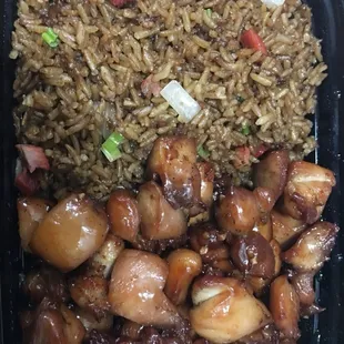 chicken, rice, and vegetables in a plastic container