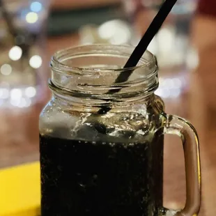 a mason jar with a straw