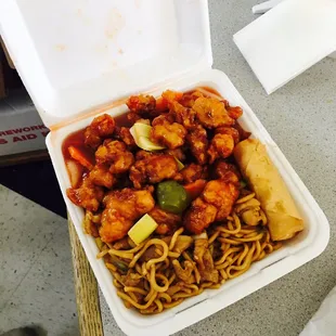 Combination plate: egg roll, chow mein, and sweet and sour chicken