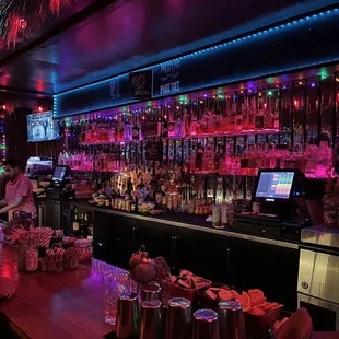 a bar with a variety of drinks